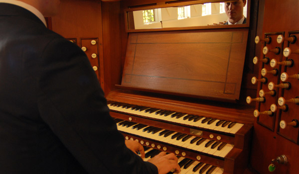 A  student practicing the organ.